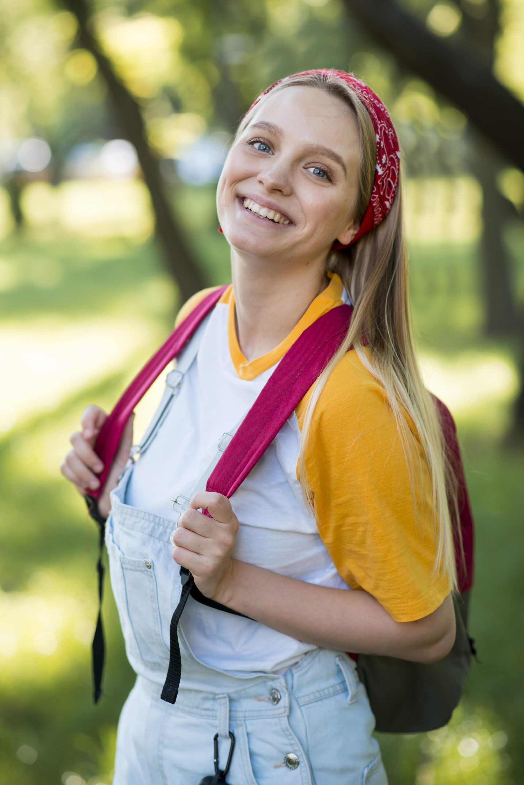 side view smiley woman posing outdoors scaled